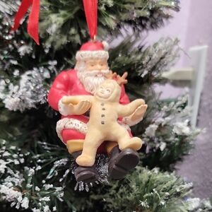 Vintage Santa Claus & child dressed as a reindeer ornament